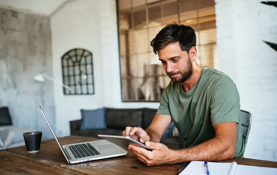 Man using technology to finance HVAC services