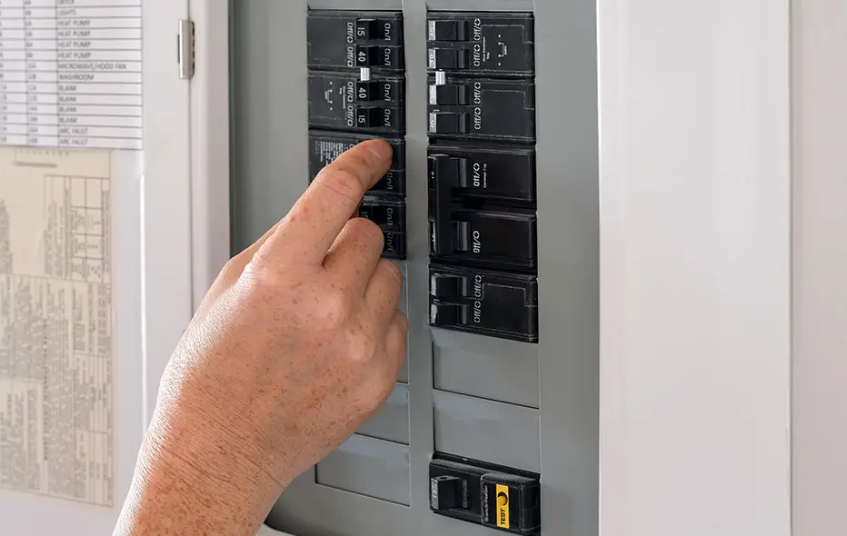 Electrician working on an electrical panel