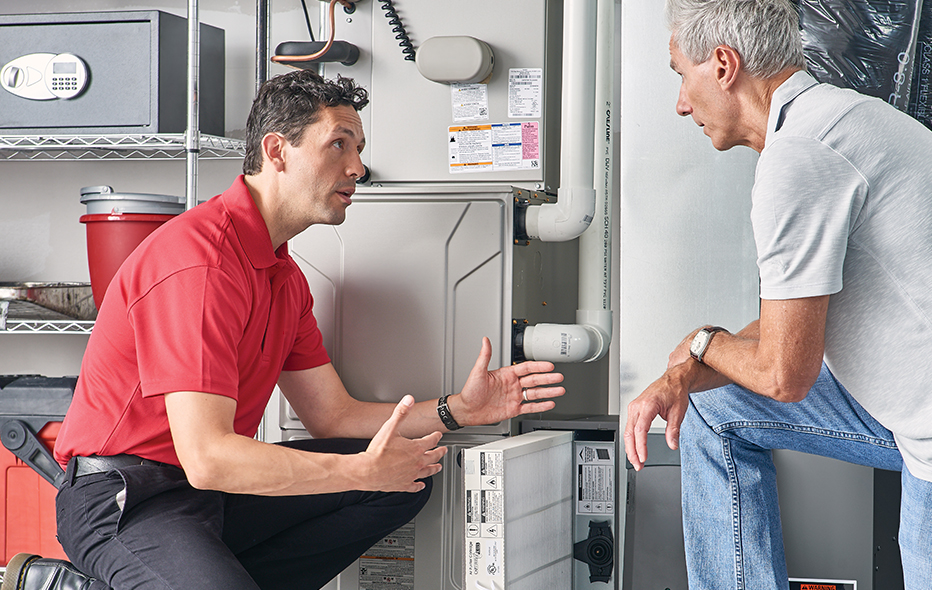 Technician talking to a homeowner