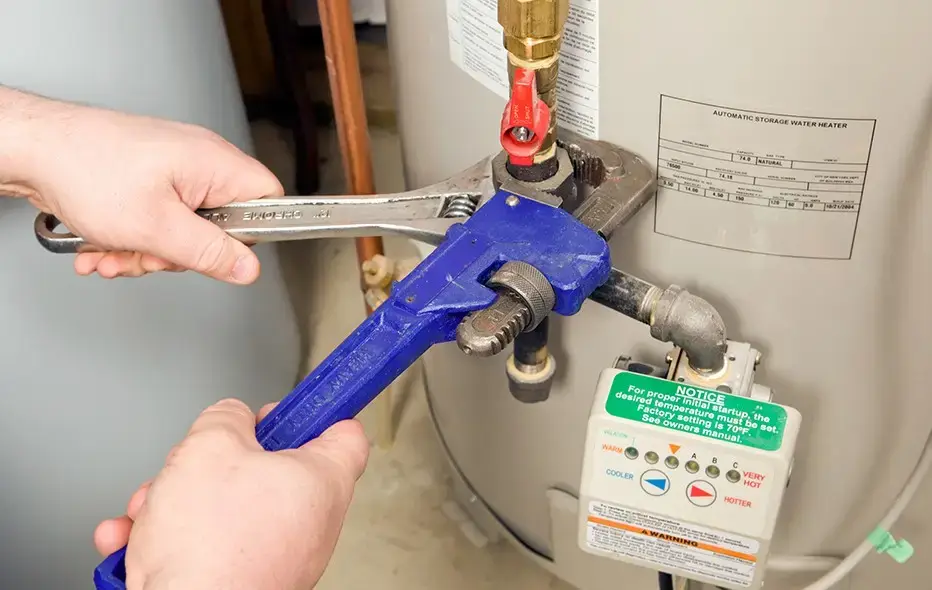 Plumber fixing a water heater